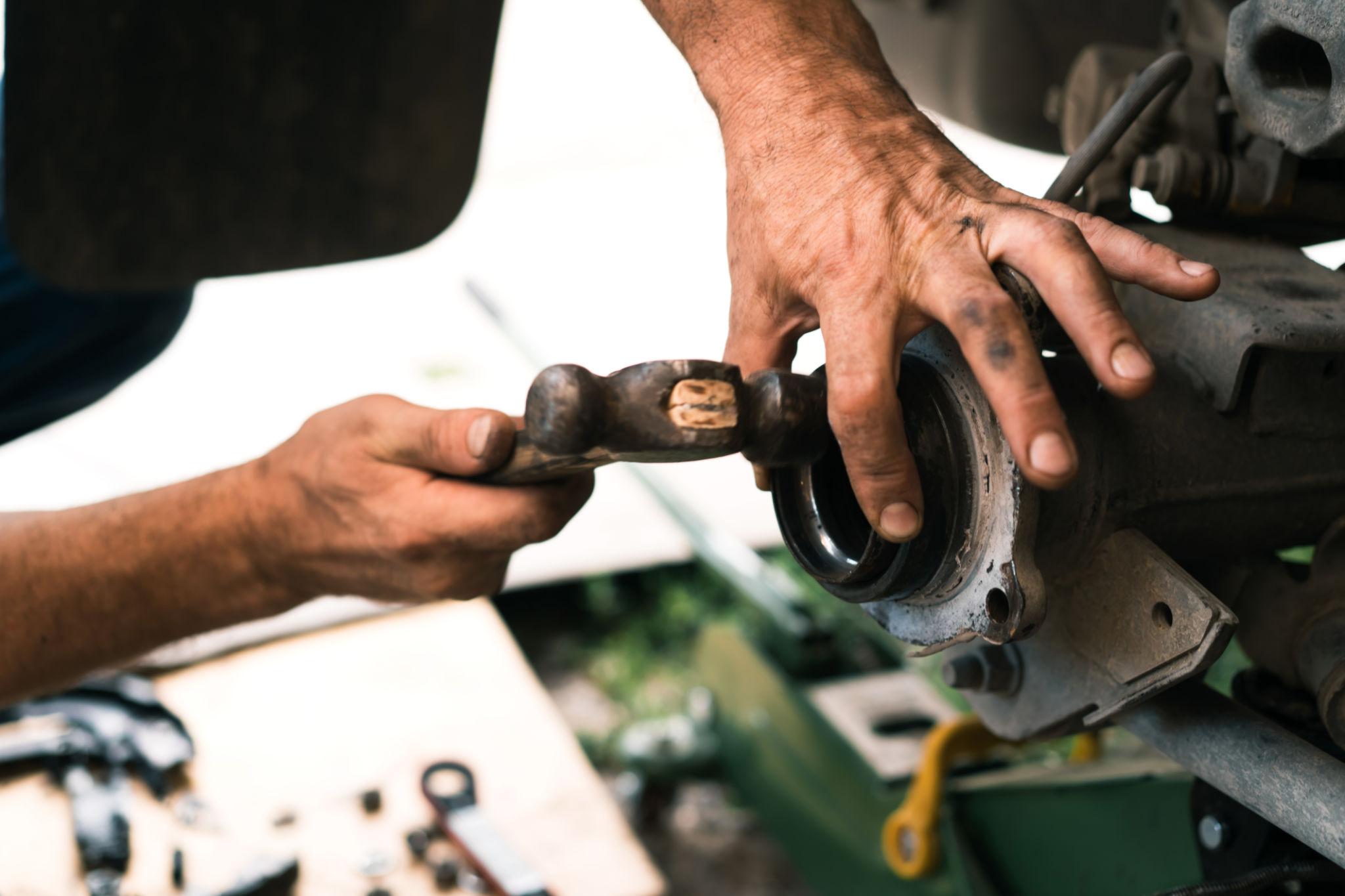 Mechanic working on an axle repair